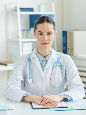 portrait-of-female-doctor-at-desk.jpg